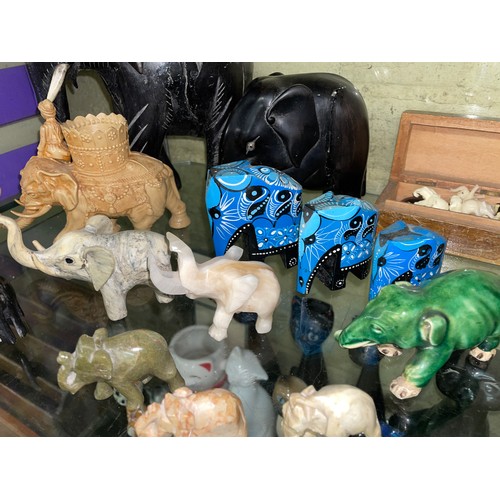 289 - SELECTION OF CARVED EBONY, SOAP STONE AND WOODEN ELEPHANT FIGURES