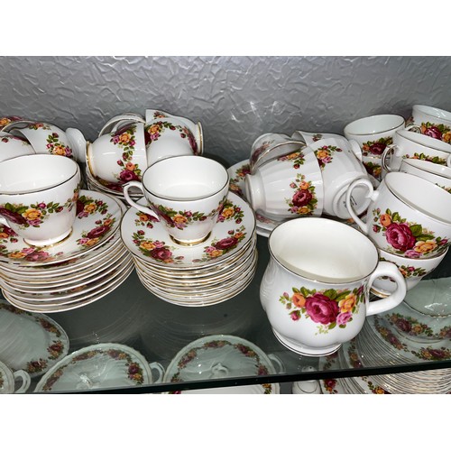 249 - TWO SHELVES OF ASHLEY AND OTHER BONE CHINA ROSE PATTERN DINNER AND TABLEWARES