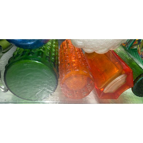 267 - HALF SHELF OF GREEN AND TANGERINE GLASS VASES, IRRIDESCENT BULB VASE, AND SPIL VASES