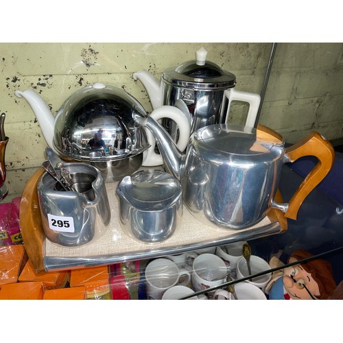 295 - PICQUOT WARE THREE PIECE TEA SERVICE ON TRAY PLUS CHROMIUM JACKETED TEAPOT AND COFFEE POT, DECO STYL... 