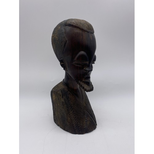 517 - FOUR CARVED WOOD AFRICAN BUSTS