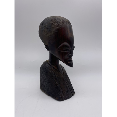 517 - FOUR CARVED WOOD AFRICAN BUSTS