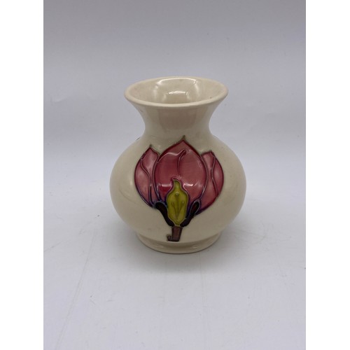 499 - MOORCROFT POTTERY SMALL SQUAT MAGNOLIA VASE AND A SQUAT HIBISCUS VASE BOTH ON CREAM GROUND