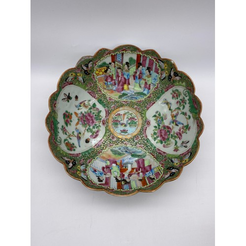 484 - 19TH CENTURY CANTON FAMILLE ROSE LOBED SHALLOW BOWL PAINTED WITH PANELS OF FIGURES AND BIRDS AND A F... 