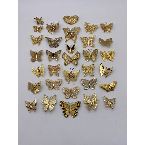 608 - BAG OF GOLD COLOURED BUTTERFLY BROOCHES