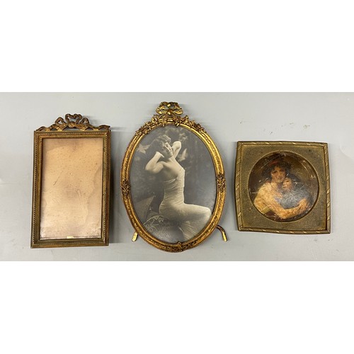 631 - GILT METAL OVAL RIBBON TIED EASIL BACK PHOTOGRAPH FRAME, SIMILAR RECTANGULAR FRAME AND ONE OTHER