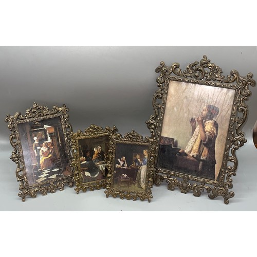 632 - SET OF GILT METAL ACANTHUS SCROLL EASIL BACK PHOTOGRAPH FRAMES CONTAINING DUTCH MASTER PHOTO PRINTS