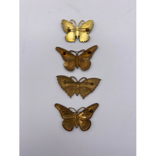 610 - BAG OF ENAMELLED BUTTERFLY BROOCHES