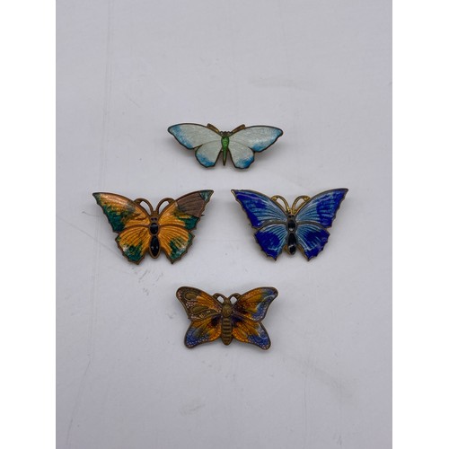 610 - BAG OF ENAMELLED BUTTERFLY BROOCHES