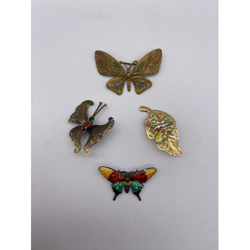 614 - BAG OF METALWORK FILIGREE AND ENAMELLED BUTTERFLY BROOCHES