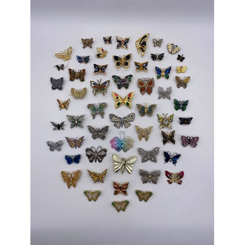 615 - BAG OF COSTUME JEWELLERY BUTTERFLY BROOCHES