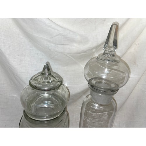 195 - TWO CYLINDRICAL GLASS JARS WITH DOMED LIDS