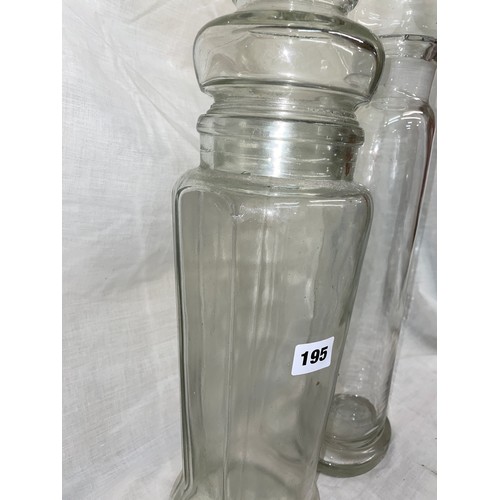 195 - TWO CYLINDRICAL GLASS JARS WITH DOMED LIDS