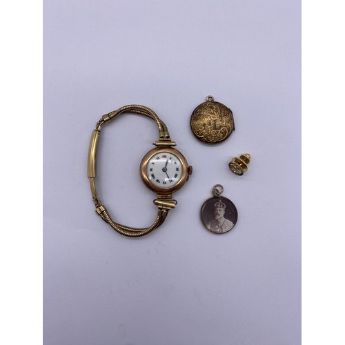 595 - LADIES CIRCULAR GOLD COLOURED WRISTWATCH ON TWO STRAND BRACELET STRAP, FRONT AND BACK CIRCULAR LOCKE... 