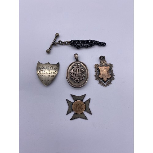 592 - SMALL BAG CONTAINING SILVER SHIELD SHAPE PLAQUE, MALTESE CROSS, MEDALLION FOB, AND LOCKET