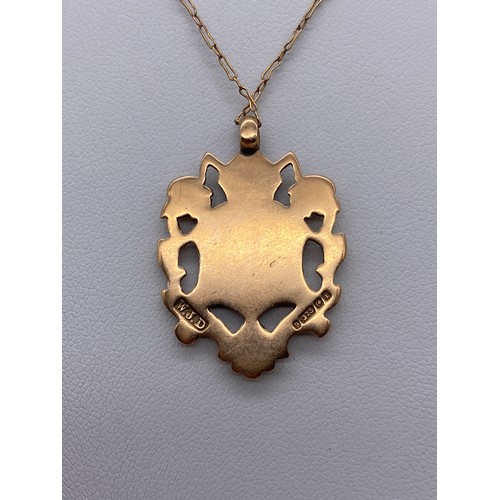 593 - 9CT ROSE GOLD SHIELD PENDANT ON TRACE CHAIN 5.5G APPROX