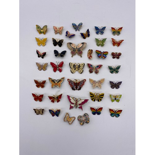 609 - BAG OF ENAMELLED BUTTERFLY BROOCHES