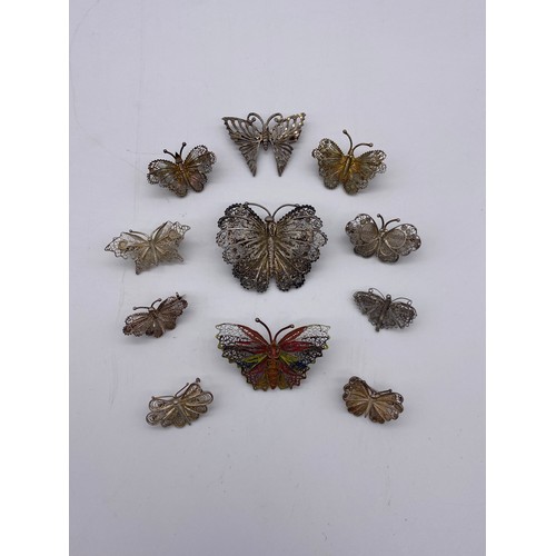 613 - BAG OF SILVER AND WHITE METAL FILIGREE AND WIRE WORK BUTTERFLY BROOCHES