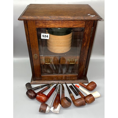 524 - OAK GLAZED SMOKERS CABINET CONTAINING A ROYAL DOULTON HUMIDOR AND VARIOUS PIPES