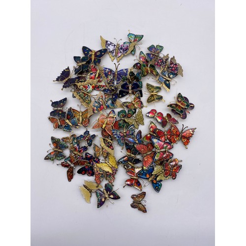 612 - TWO BAGS OF GLITTER WING BUTTERFLY BROOCHES