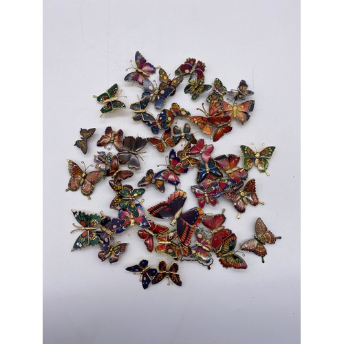 611 - TWO BAGS OF BUTTERFLY BROOCHES