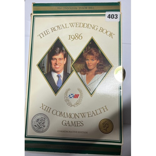 403 - COMMEMORATIVE EDITION THE ROYAL WEDDING BOOK 1986 COMMON WEALTH GAMES TWO POUND COIN