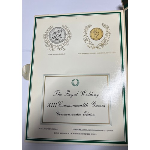 403 - COMMEMORATIVE EDITION THE ROYAL WEDDING BOOK 1986 COMMON WEALTH GAMES TWO POUND COIN