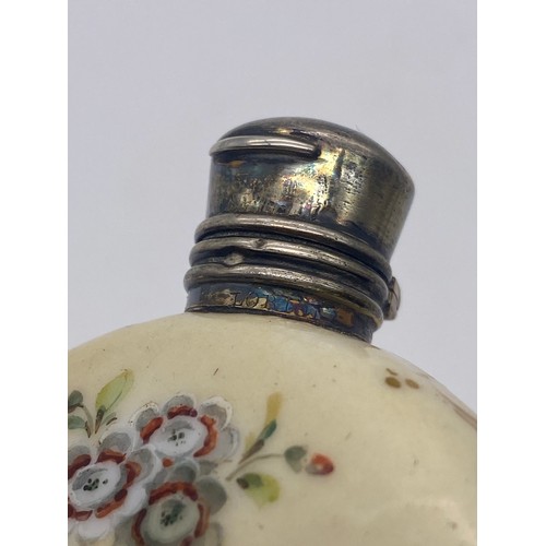 219 - WHITE METAL HINGED LID PORCELAIN MOON FLASK SCENT BOTTLE PAINTED WITH BIRDS AMIDST FLORAL SPRAYS