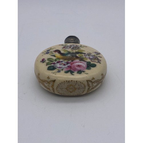 219 - WHITE METAL HINGED LID PORCELAIN MOON FLASK SCENT BOTTLE PAINTED WITH BIRDS AMIDST FLORAL SPRAYS