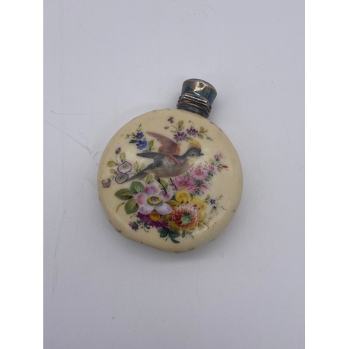 219 - WHITE METAL HINGED LID PORCELAIN MOON FLASK SCENT BOTTLE PAINTED WITH BIRDS AMIDST FLORAL SPRAYS