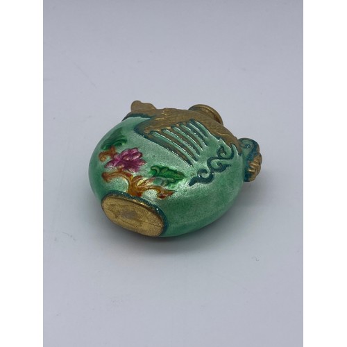 234 - ORIENTAL GREEN LUSTRE AND GILT SNUFF BOTTLE AND A DOUBLE GOURD CERAMIC SCENT PHIAL