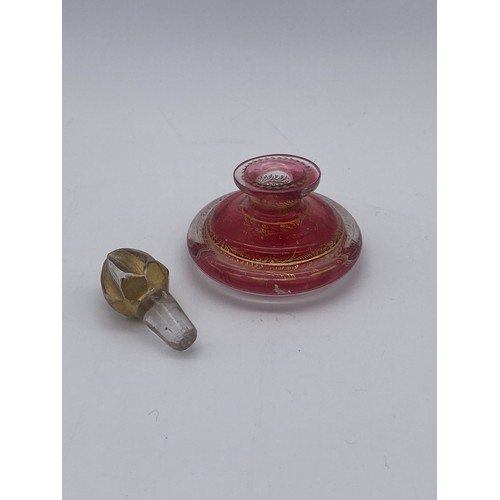 242 - VICTORIAN RUBY OVERLAY SHAPED SCENT BOTTLE (TOP BROKEN), AMETHYST ETCHED BOTTLE AND STOPPER, GILT DE... 