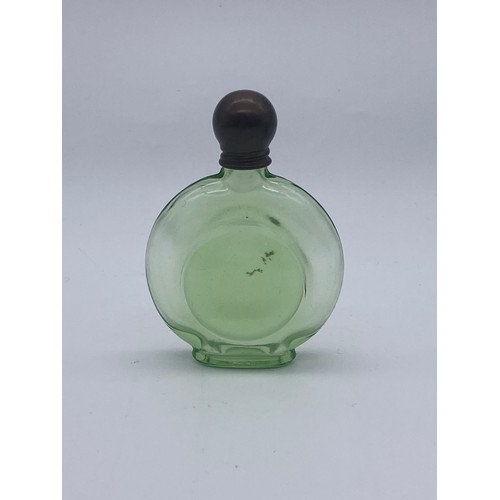 244 - TINTED GREEN GLASS SCREW TOP MOON FLASK SCENT BOTTLE, TWO VASELINE GLASS BOTTLES AND ONE GRADUATED B... 