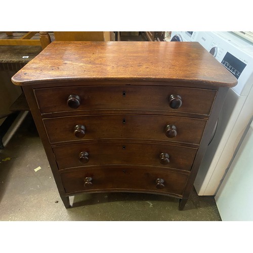 98 - REGENCY PERIOD MAHOGANY CONCAVE CHEST OF FOUR DRAWERS