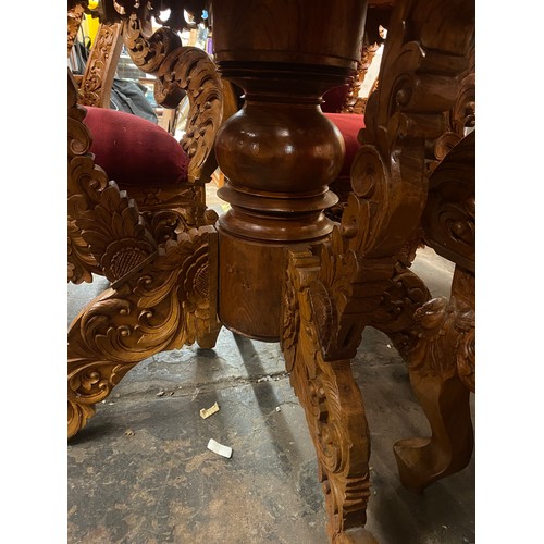 69 - HEAVILY CARVED CIRCULAR PEDESTAL DINING AND FOUR UPHOLSTERED HIGH BACK CHAIRS