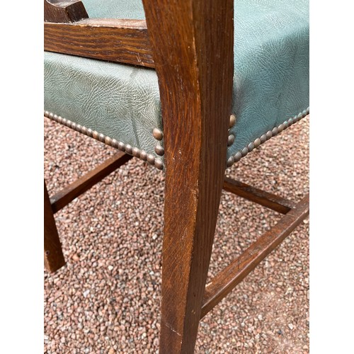 133 - EDWARDIAN OAK PIERCED FIDDLE BACK ELBOW CHAIR