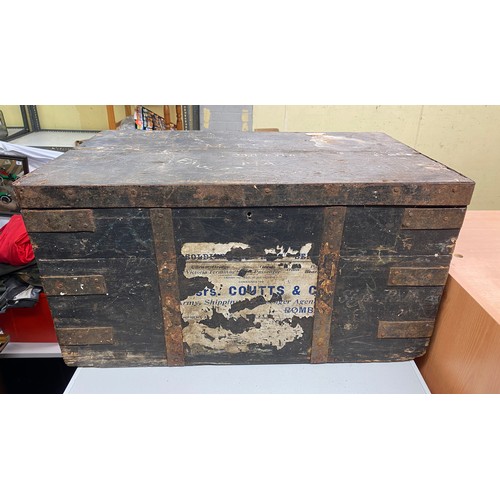 23 - BLACK AND PINE METAL BANDED TRUNK WITH PAPER LABELS