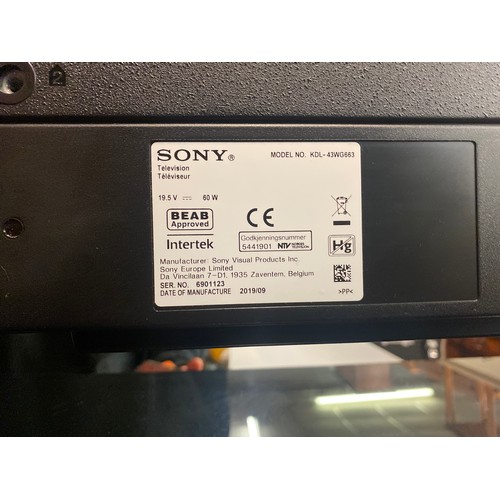 71 - SONY TV ON BLACK AND GLASS MEDIA STAND