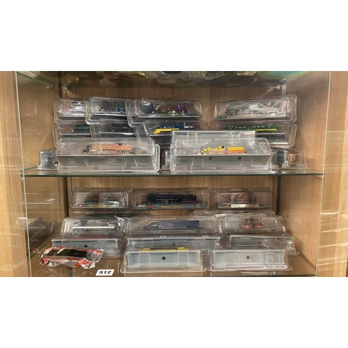 512 - TWO SHELVES OF DEL PRADO LOCOMOTIVE AND DIESEL TRAIN MODELS IN BLISTER PACKS