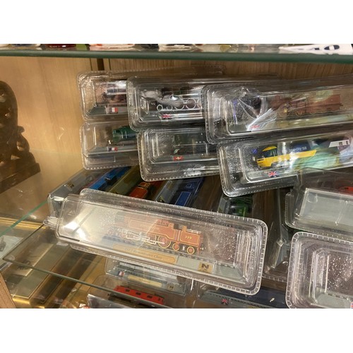 512 - TWO SHELVES OF DEL PRADO LOCOMOTIVE AND DIESEL TRAIN MODELS IN BLISTER PACKS