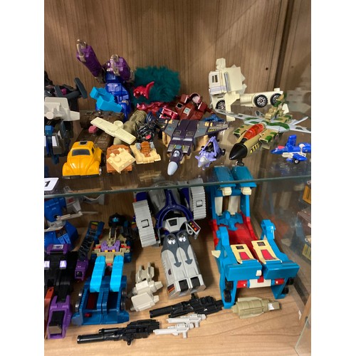 511 - TWO SHELVES OF TRANSFORMER ACTION FIGURES