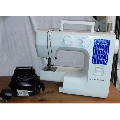 373 - NEW HOME ELECTRIC SEWING MACHINE AND PEDAL