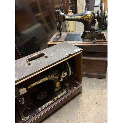 33 - TWO MANUAL SEWING MACHINES IN CASE