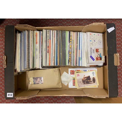 412 - BOX OF ROYAL MAIL MINT STAMP PRESENTATION PACKS AND SOME POSTCARDS AND FIRST DAY COVERS