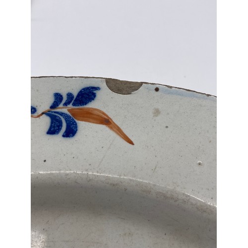 567 - EARLY 18TH CENTURY TIN GLAZED DELFT SHALLOW BOWL DECORATED WITH FLOWERS