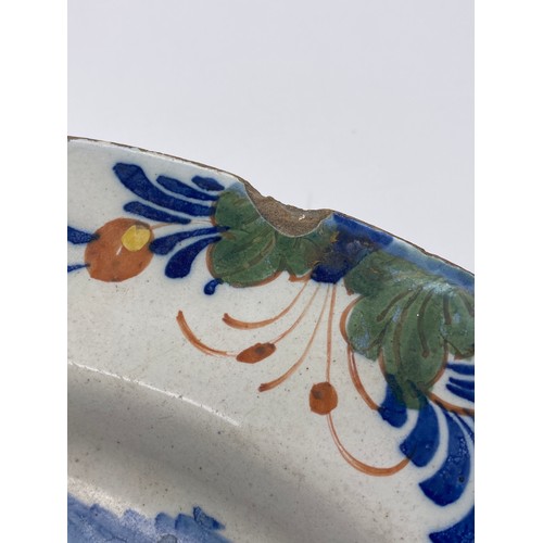 567 - EARLY 18TH CENTURY TIN GLAZED DELFT SHALLOW BOWL DECORATED WITH FLOWERS