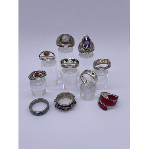 423 - 10 SILVER AND WHITE METAL ENAMEL AND  AND SEMI PRECIOUS STONE SET DRESS RINGS 1.3OZT OVERALL