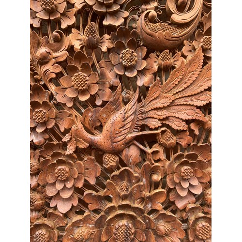 134 - CARVED HARD WOOD RECTANGULAR PANEL DECORATED WITH BIRDS AMIDST FOLIAGE