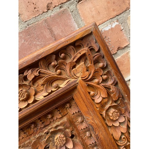 134 - CARVED HARD WOOD RECTANGULAR PANEL DECORATED WITH BIRDS AMIDST FOLIAGE