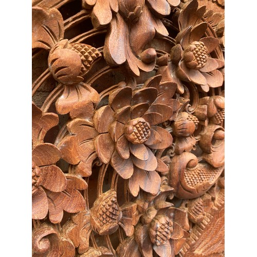 134 - CARVED HARD WOOD RECTANGULAR PANEL DECORATED WITH BIRDS AMIDST FOLIAGE